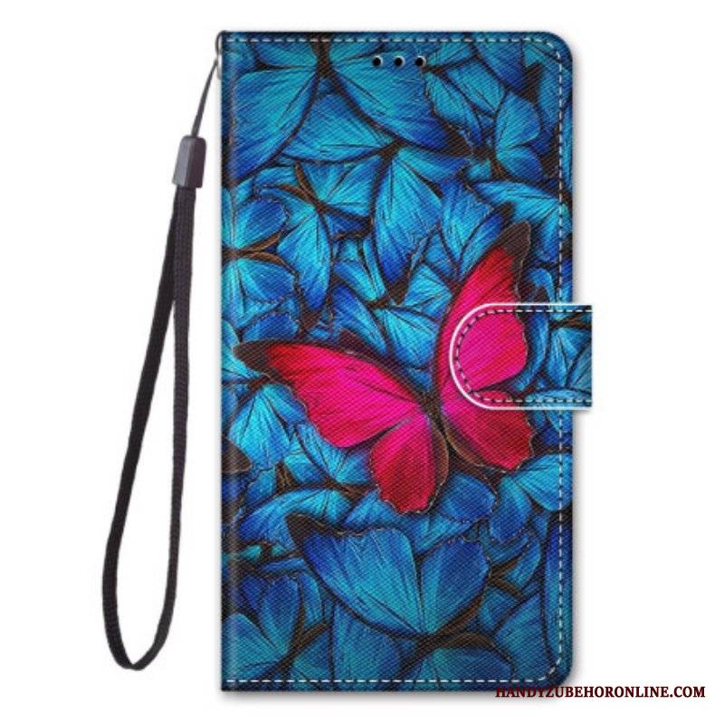 Etui Folio do Sony Xperia 1 IV Czerwony Motyl Niebieskim Tle